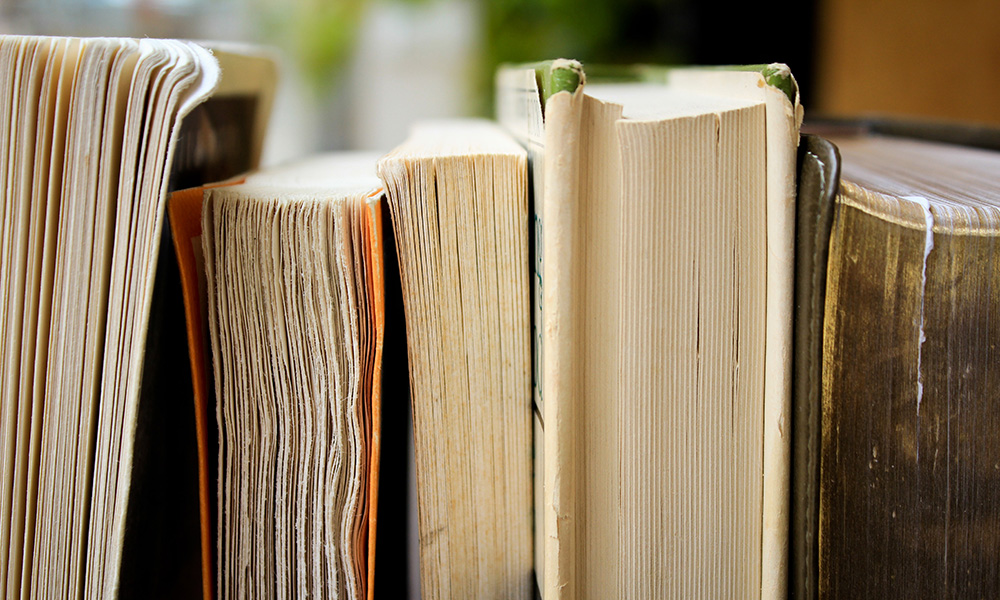 row of upright books.