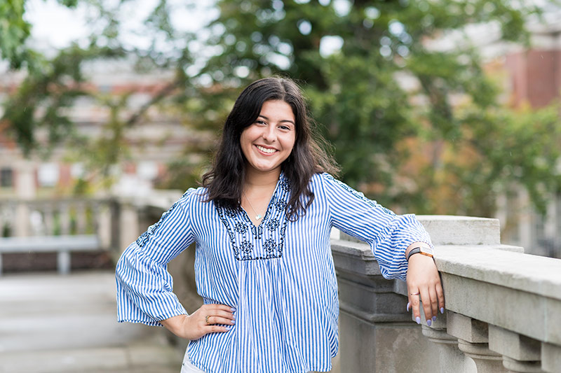 portrait of student standing on the quad.