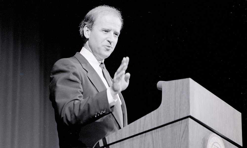 archival photo of Joe Biden speaking in Strong Auditorium