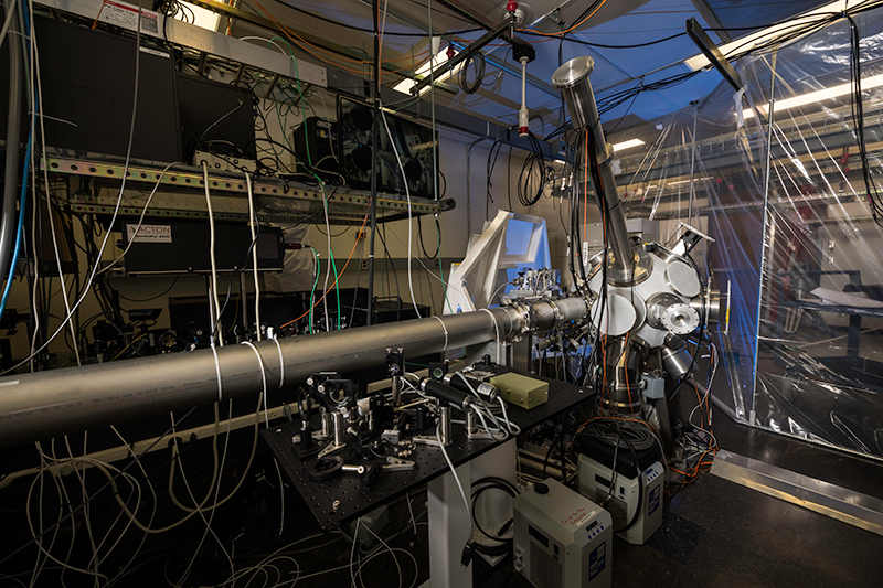 lasers and optical equipment inside a lab.
