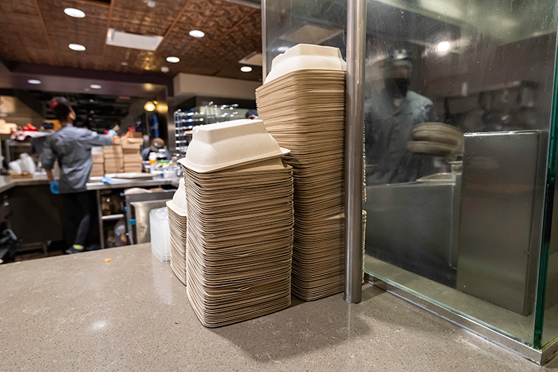 stacks of food containers on a countertop.