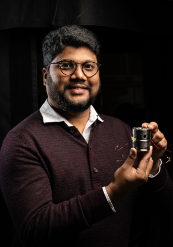 Ranga Dias holds a diamond anvil array.