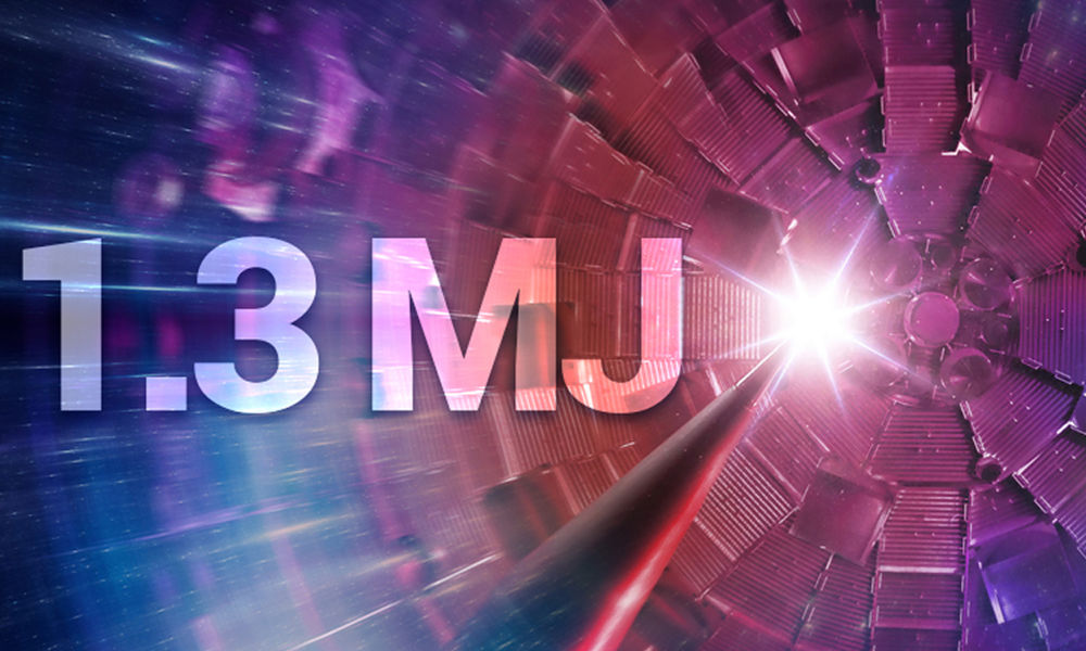 1.3 megajoules written near a spark within a rendering of an ignition facility.