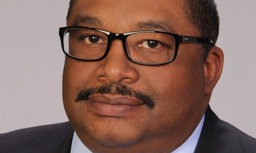 Feature image Close-up horizontal crop of Harl Tolbert's formal headshot.