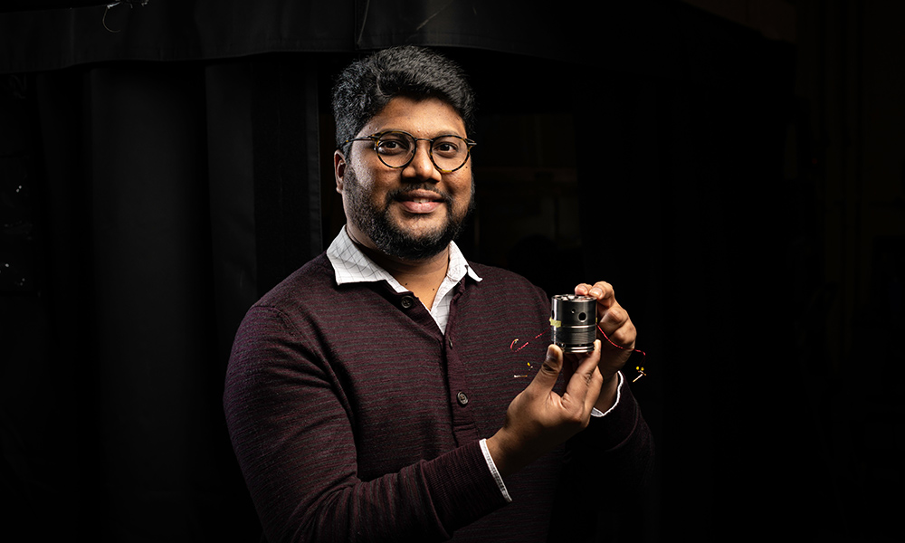 Ranga Dias holds an array containing diamond anvil cells