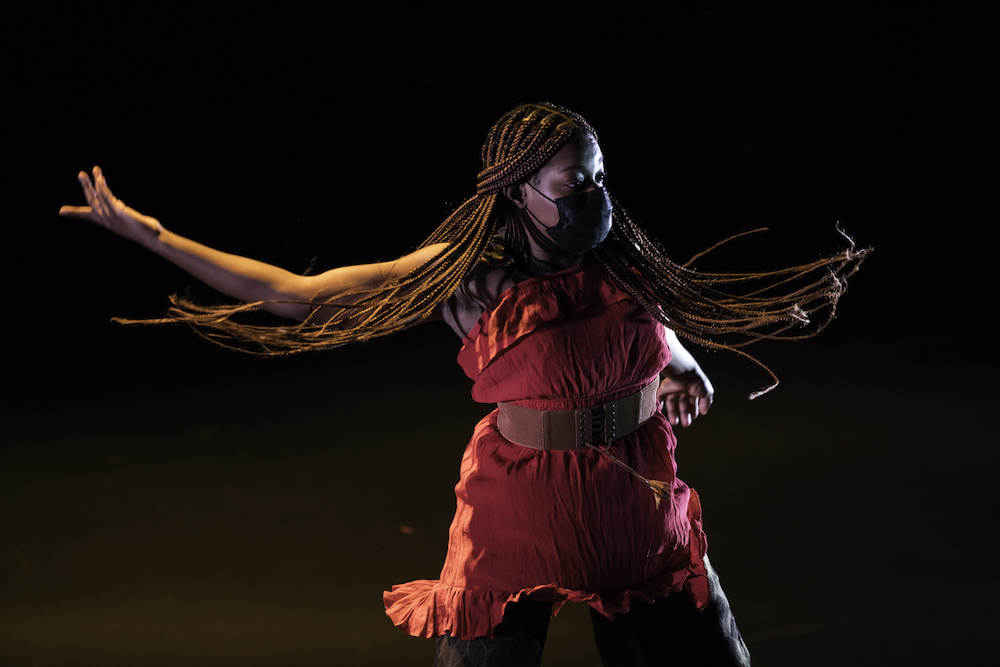 student dances as her hair flares out around her