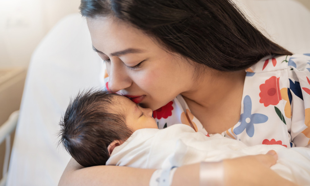 mother holding her infant.