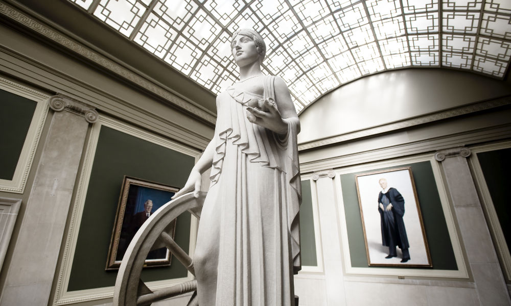 Statue of Industry in Rush Rhees Library stairway.