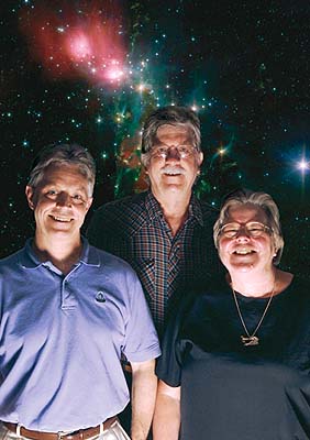 portrait of three people in front of a backdrop showing an image of stars