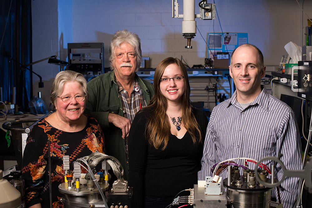 group portrait of four people in a lab. 