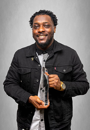 portrait of Rashad smith holding an award