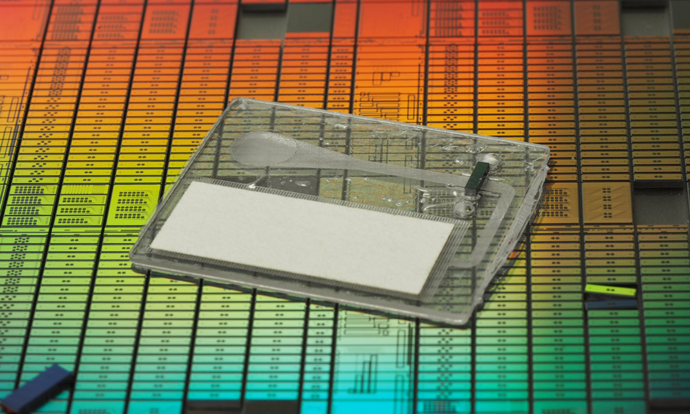 illustration of an integrated photonic chip against a colorful background.