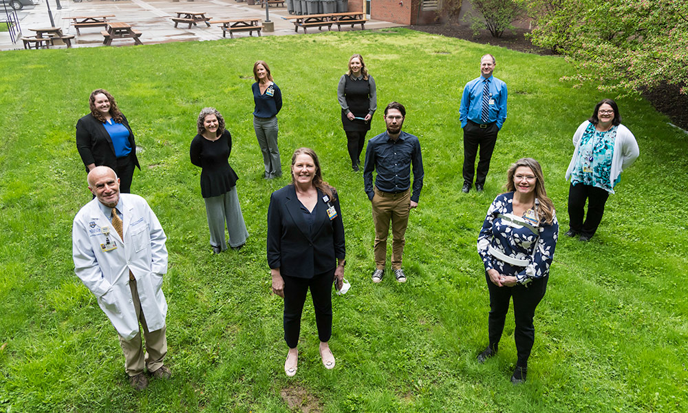 group portrait of SMH Infection Prevention Team, standing outdoors, socially distanced.