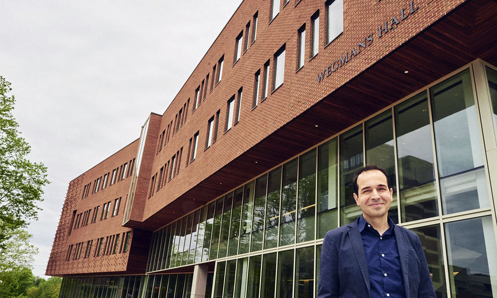 Muidat Cetin stands in front of Wegmans Hall