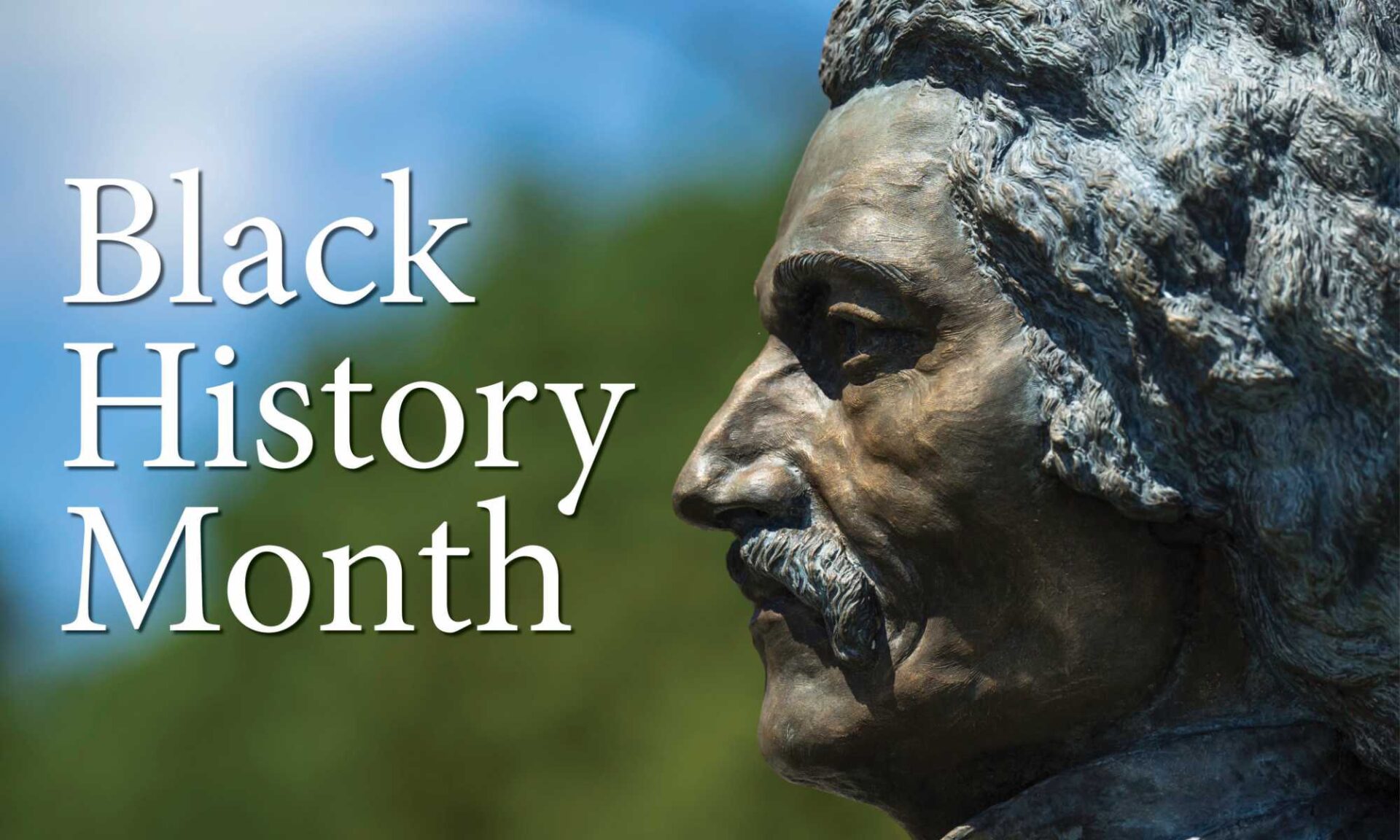 Statue of Frederick Douglass in profile looking toward text that reads Black History Month.
