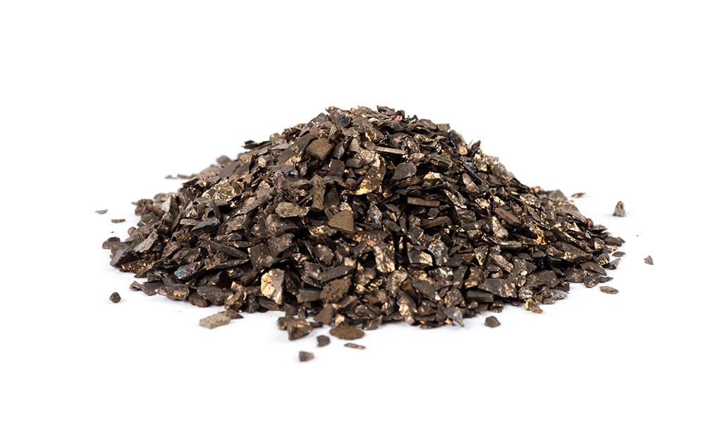 Feature image pile of manganese metal on a white background.