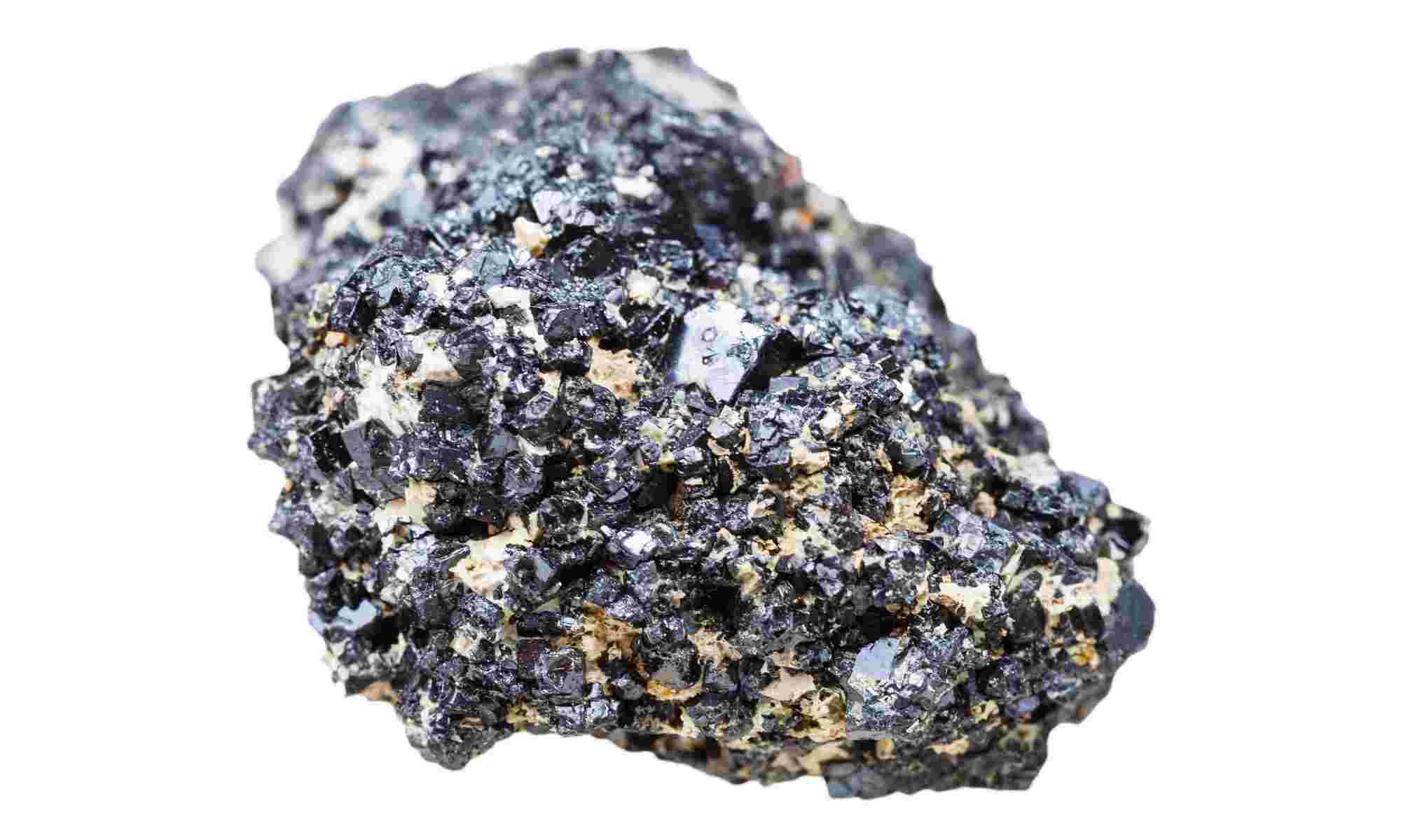 Close-up of a perovskite crystalline stone against a white background. Perovskites show great potential as light absorbing material.
