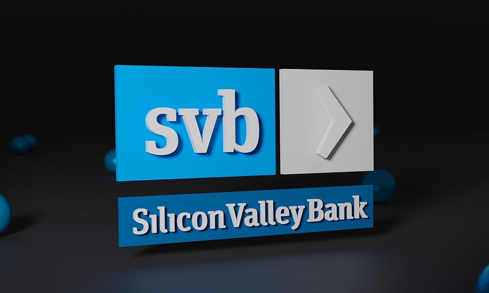 Blue rectangular logo for Silicon Valley Bank against black background suggesting collapse of SVB.