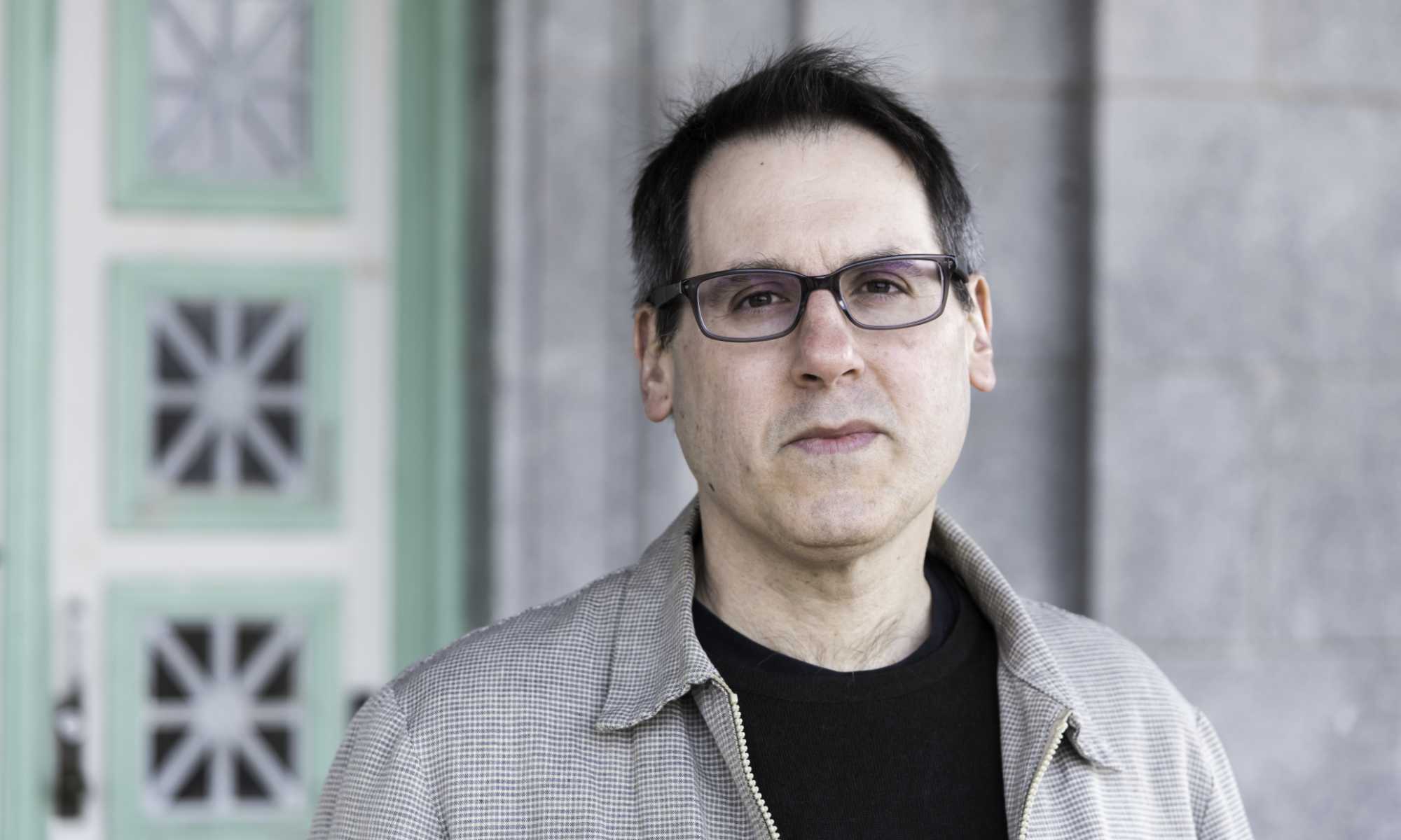 Feature image Close-up photo of Steven Schottenfeld, author of This Room Is Made of Noise.