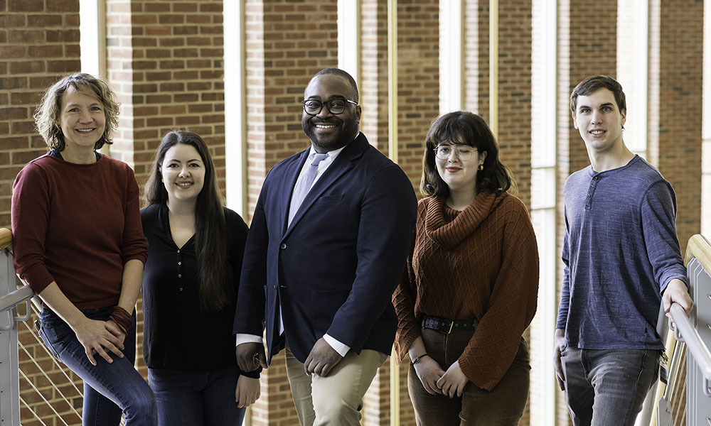 Feature image Five members of Digital Media Studies and MAG partnership to promote arts integration and digital equity standing in row, smiling.