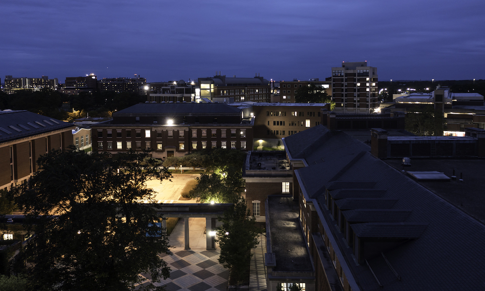 University buildings are seen from above at twilight