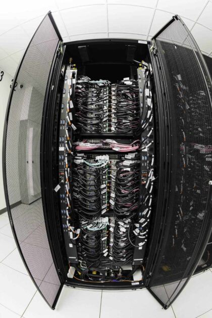 An interior view of the Conesus supercomputer shows an abundance of wires and cords. 