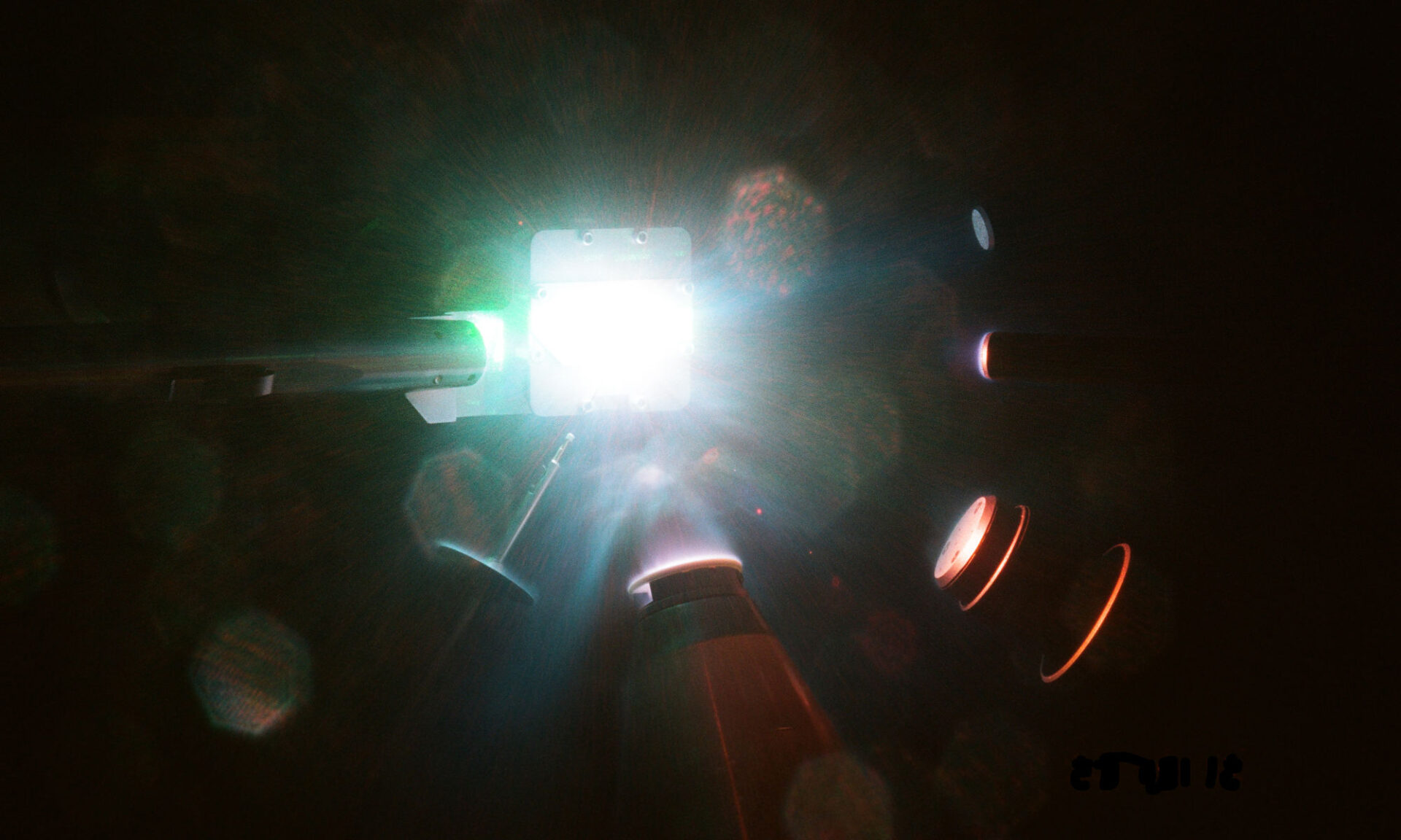 Various diagnostic tools pointing at an x-ray diffraction image plate with material on it.