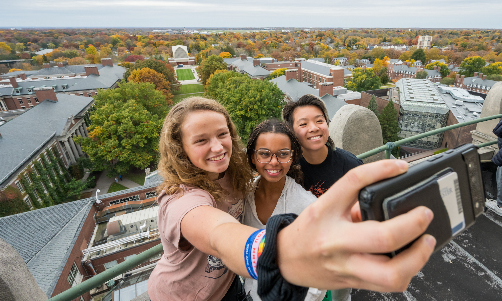 Students take a selfie from atop the Rush Rhees Library tower