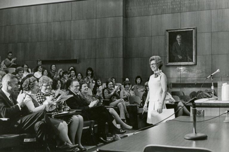 Loretta Ford stands confidently before a crowd, sharing her insights as a former dean of the School of Nursing.