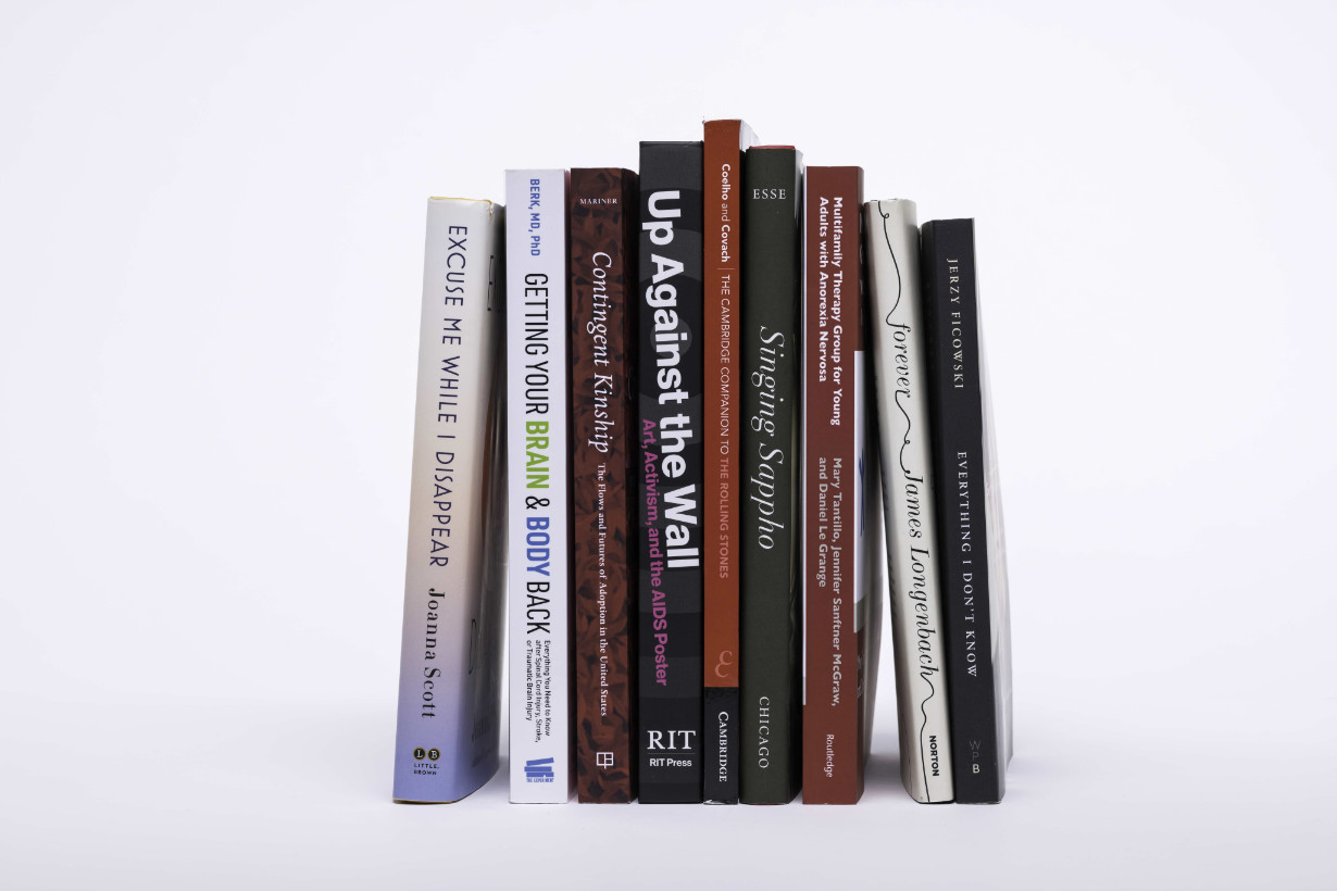Upright stacks of books authored by University of Rochester experts.