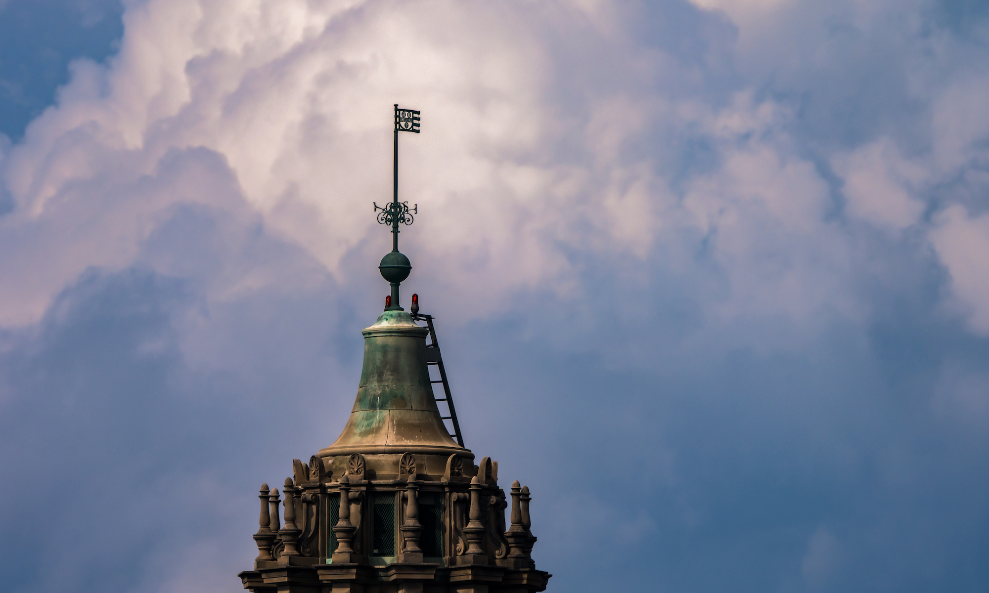 Storm clouds roll past University of Rochester’s Rush Rhees Library.