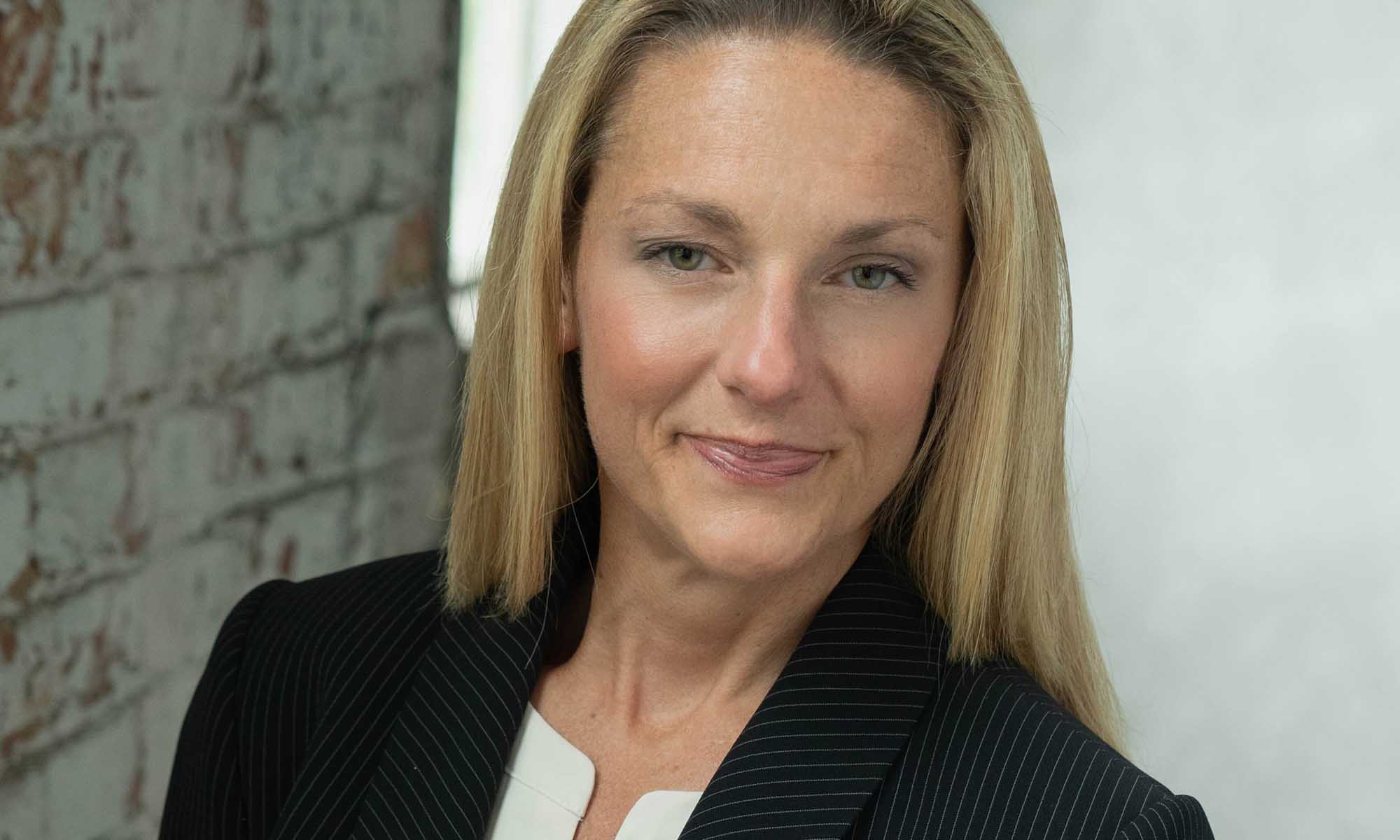 Horizontal crop of a portrait of Carey Anne Zucca.