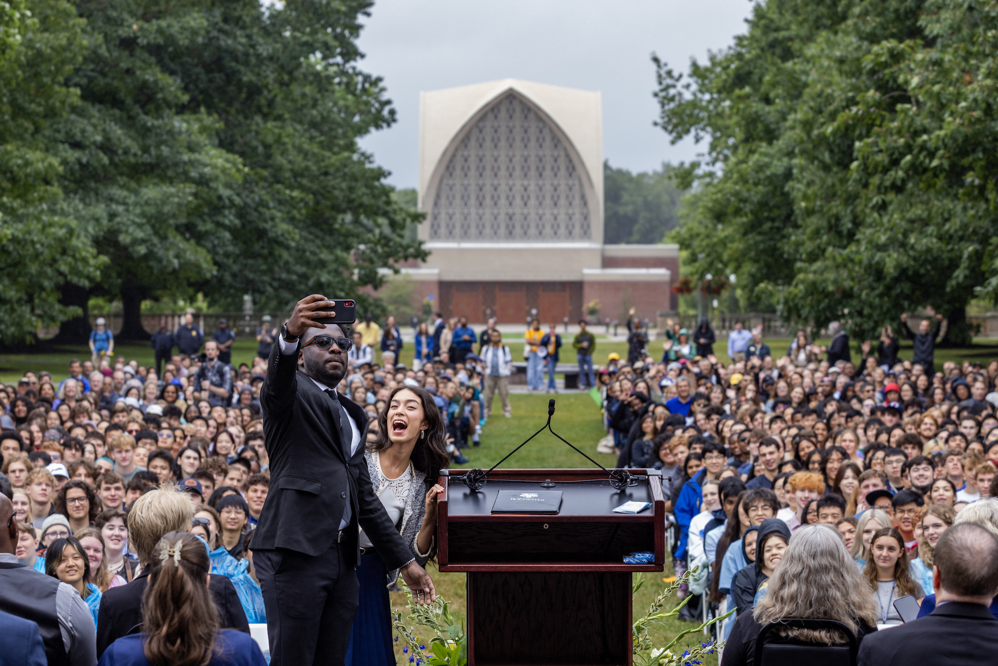 University of Rochester Student Association President John Conduah and Eastman School of Music Student Association President Nichole Waligora take a selfie during a convocation ceremony. 