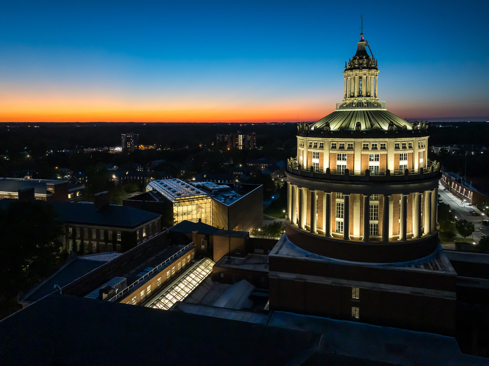 University of Rochester’s Rush rhees Library is pictured via aerial drone a twilight. 