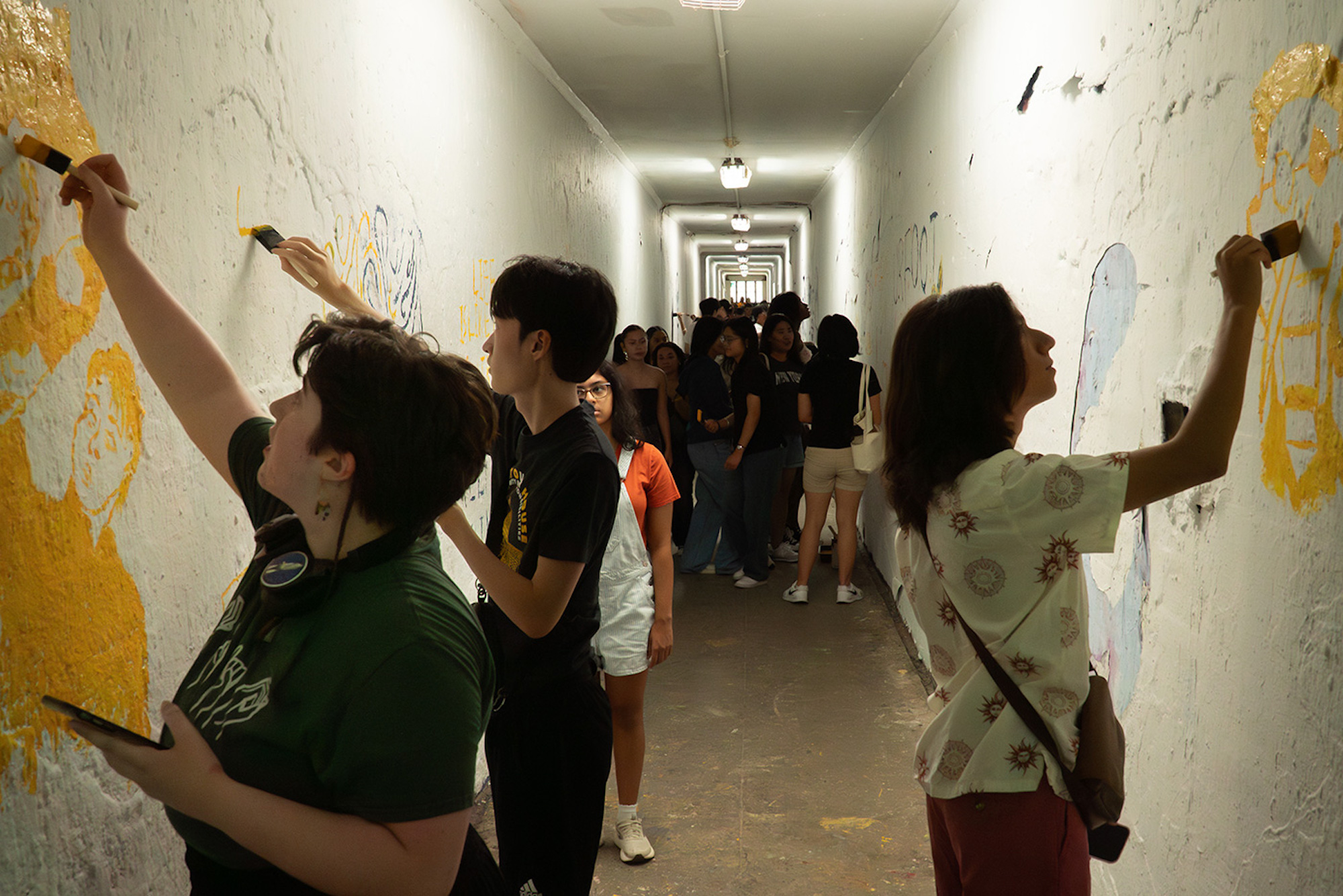 Students paint in the tunnel. 