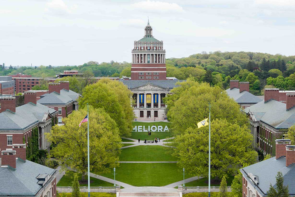 Aerial view of Rush Rhees Library and the Eastman Quadrangle with the giant letters spelling out Meliora.