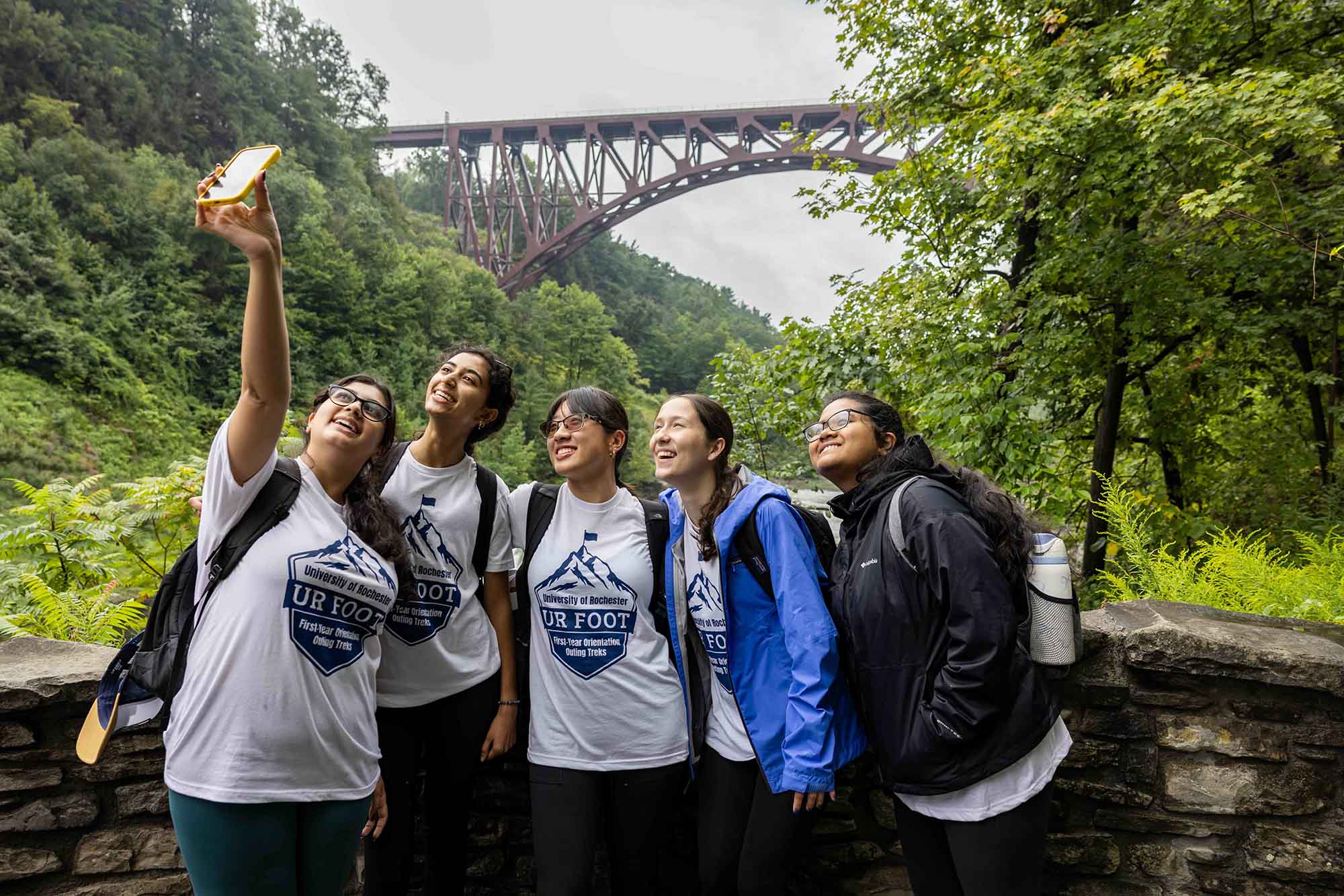 Five University of Rochester students take a selfie in Letchworth Park. 