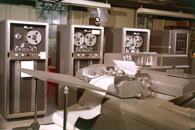Sepa-toned image of tape drives and a printer at the University of Rochester.