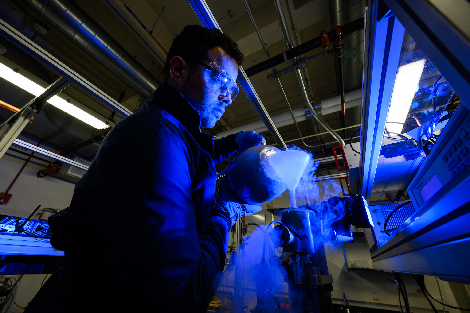 A PhD student uses liquid nitrogen in a lab. 
