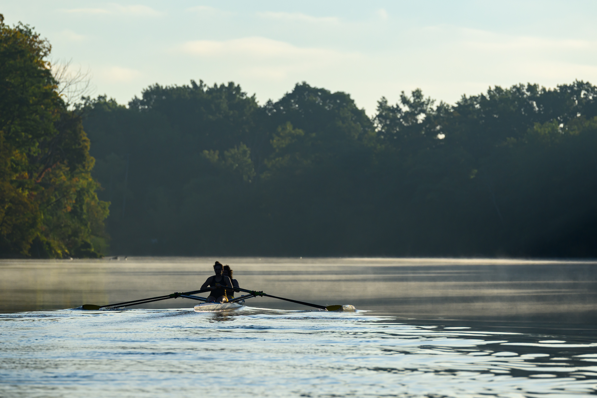 Members of the women’s rowing team practice on the Genesee River. 