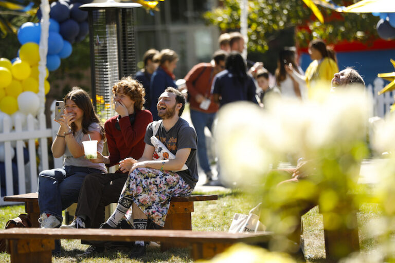 A small crowd reacts happily.