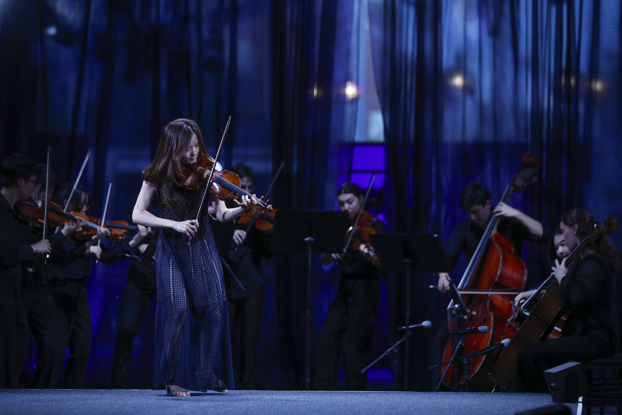 YooJin Jang, an assistant professor of violin, playing the University's Stradivarius violin, accompanied by students from the Eastman School of Music.