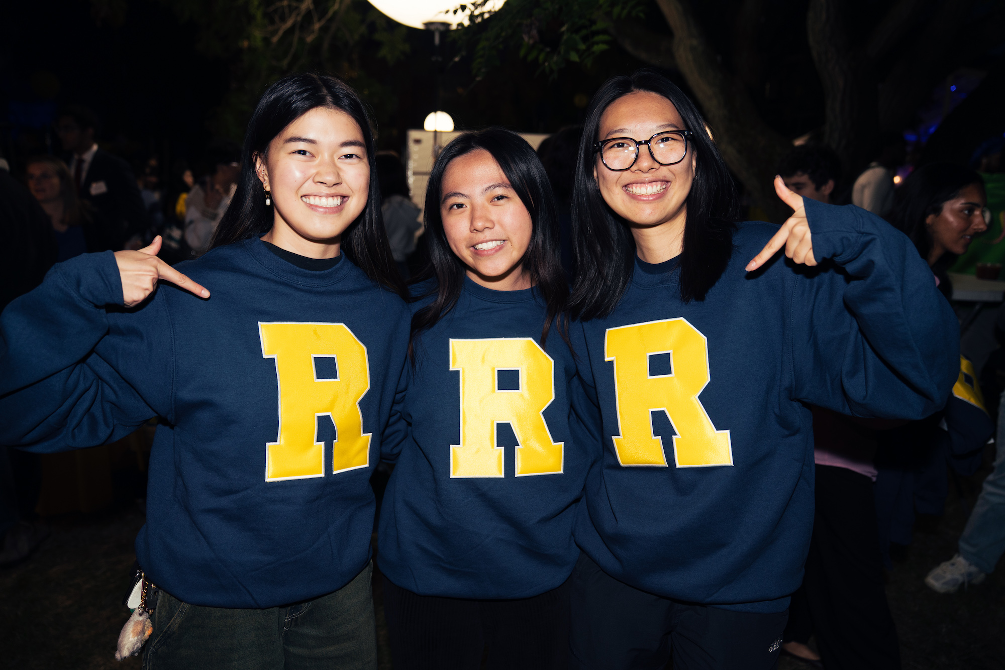 Malia Dickinson (Left), Amanda Wang (Middle), Yi Ren (Right) receive class swag at the Rochester Traditions Giveaway.