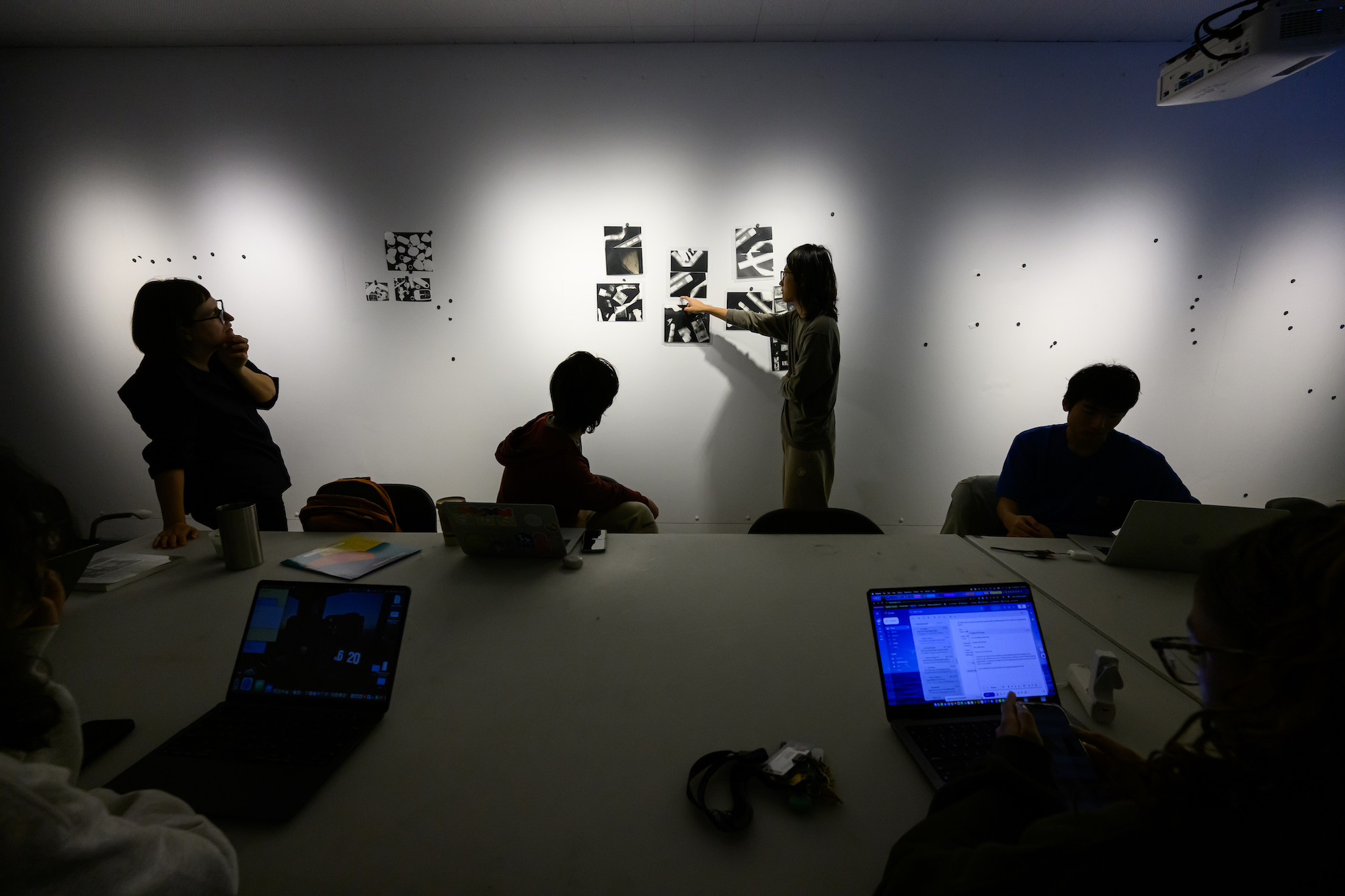 A professor teaching a class on SLR cameras. 