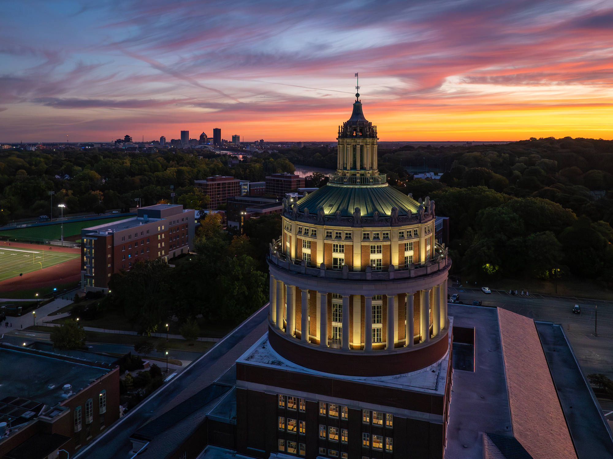River Campus and Rush Rhees Library are seen via aerial drone at dawn.
