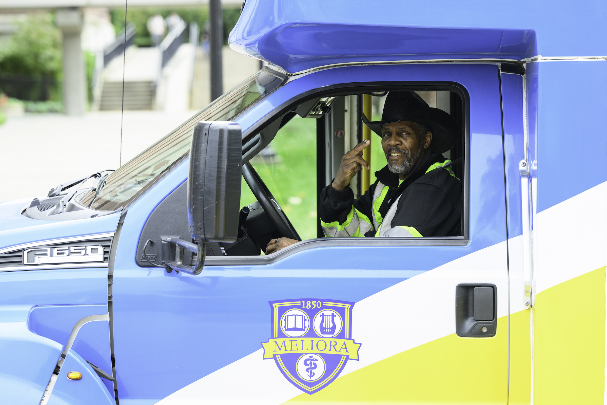 Shuttle driver Joe Hill poses for a quick photo during a stop.