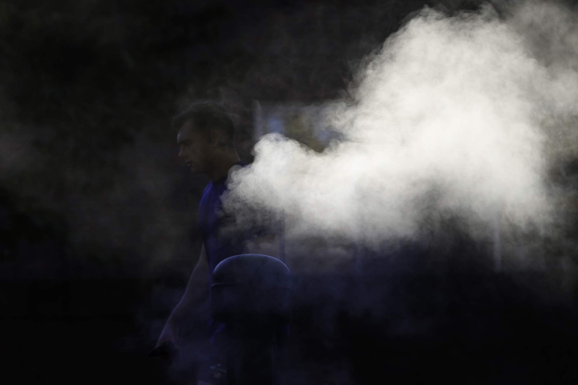 A student walks past a steam outlet near Susan B. Anthony Bowl. 