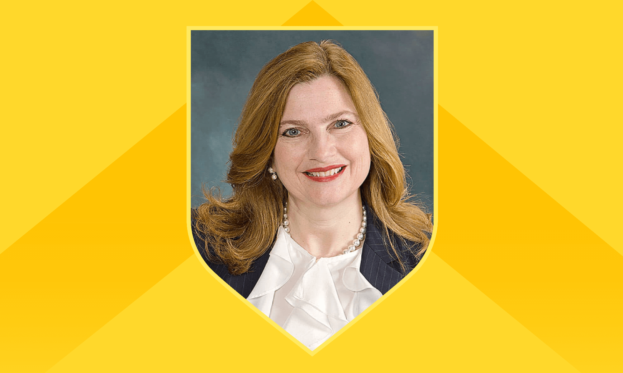 A woman with red hair stands against a yellow background, identified as Kathy Gallucci, HR officer at the University of Rochester.