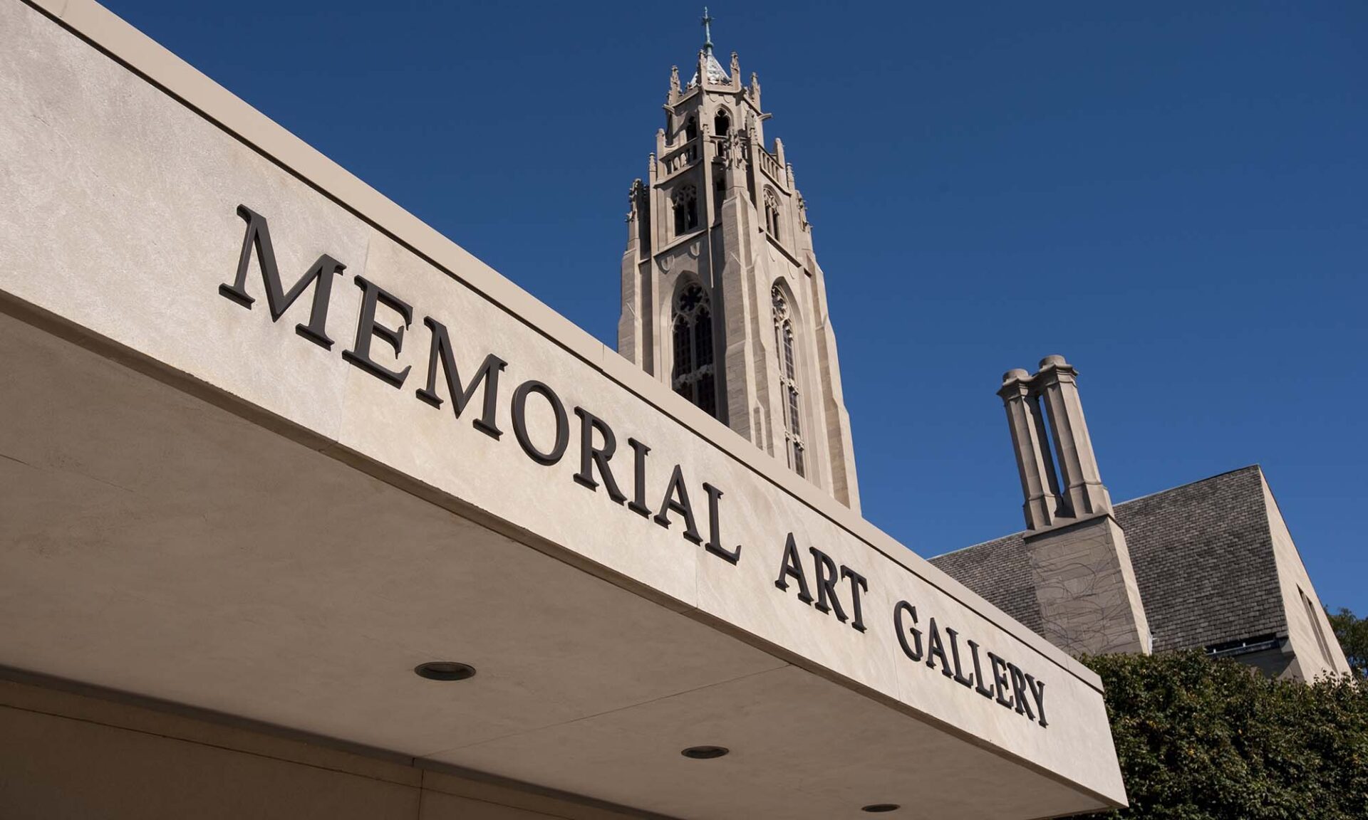 Close up of the Memorial Art Gallery entrance with Cutler Union tower in the background.