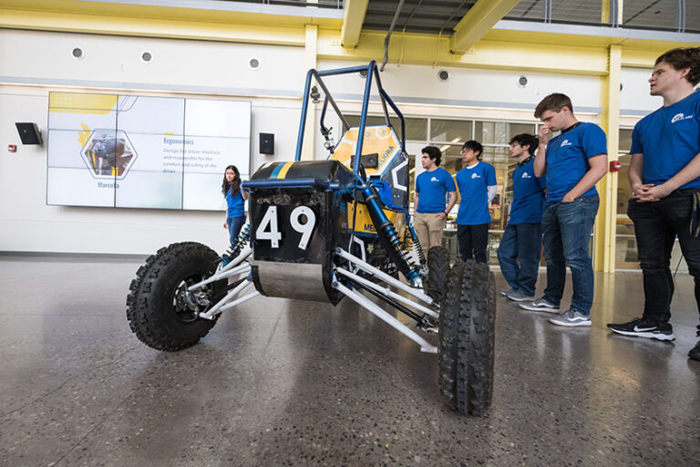 The UR Baja SAE team unveils their car in Rettner Atrium.